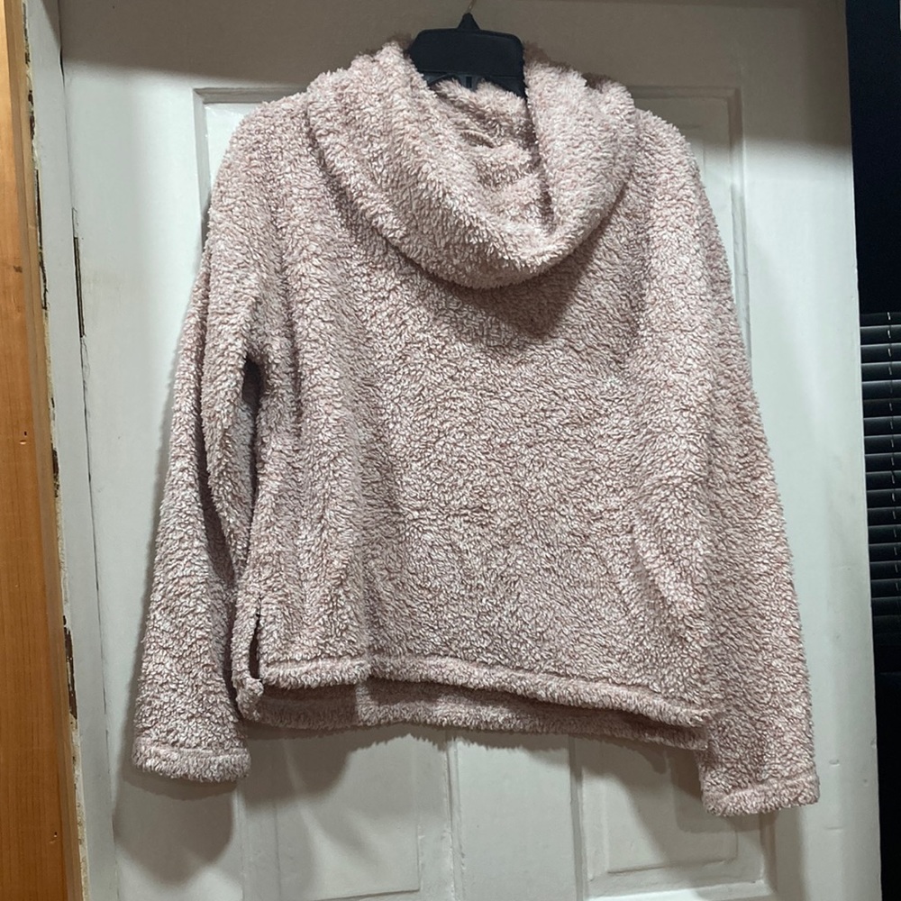 Pink fuzzy sweater.